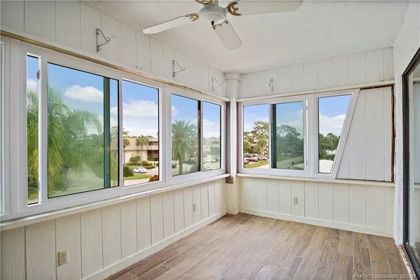 a view of livingroom with hardwood floor and a ceiling fan