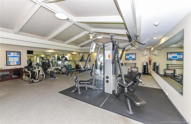 a bedroom with a bed and a dresser in it