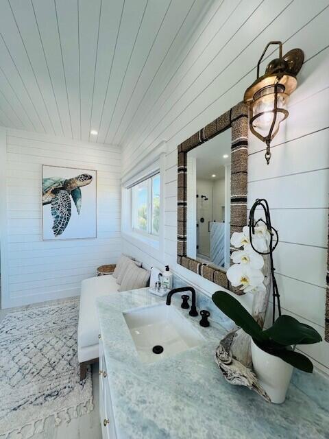 358 Stirrup Key Boulevard Marathon, FL 33050 - Photo 13 of 29 a bathroom with a sink and mirror with bathtub