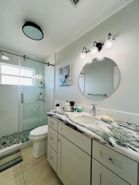 358 Stirrup Key Boulevard Marathon, FL 33050 - Photo 21 of 29 a bathroom with a granite countertop sink toilet and a mirror
