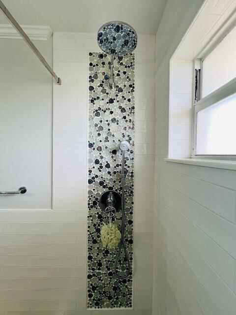 358 Stirrup Key Boulevard Marathon, FL 33050 - Photo 22 of 29 a bathroom with a shower curtain and a window