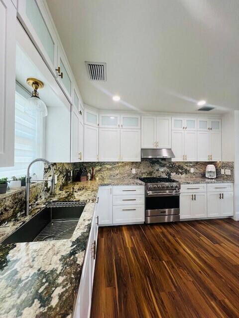 358 Stirrup Key Boulevard Marathon, FL 33050 - Photo 7 of 29 a kitchen with stainless steel appliances granite countertop a stove a sink and a refrigerator