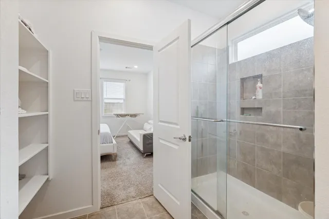 a bathroom with a bathtub and shower