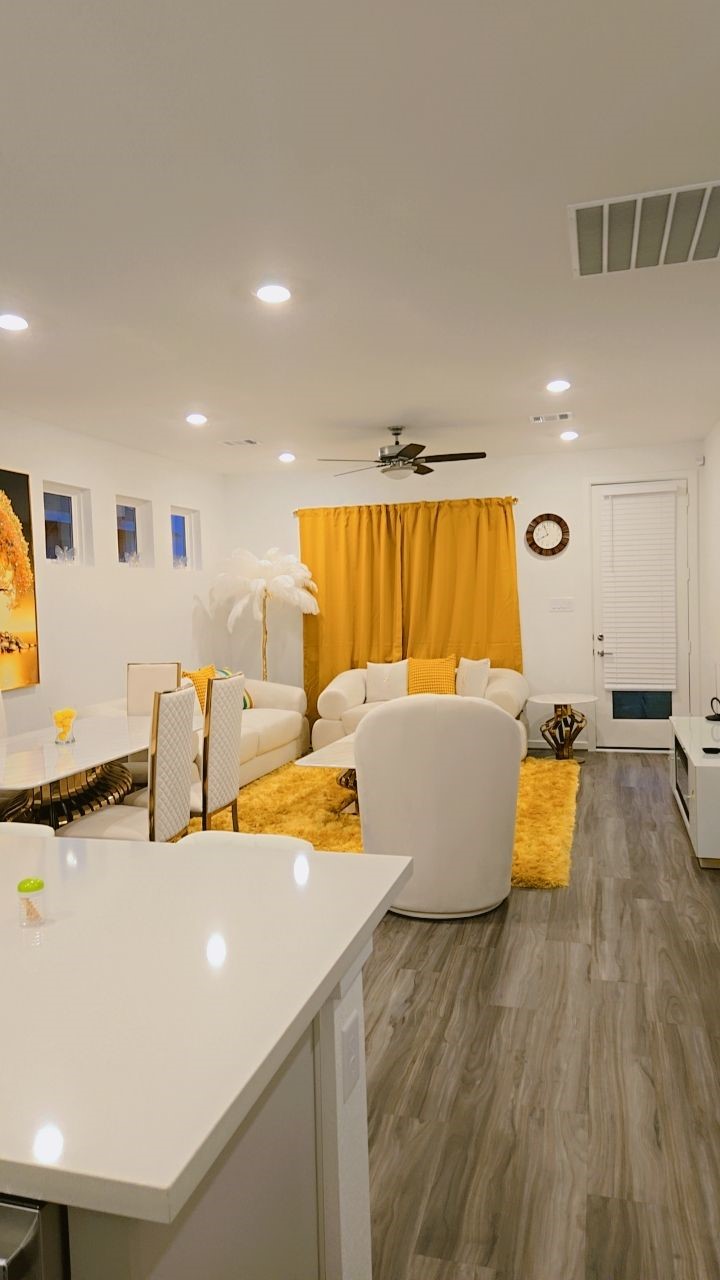 7122 Clearwater Cv Drive Cypress, TX 77433 - Photo 3 of 10 a kitchen with stainless steel appliances granite countertop a sink and a living room view