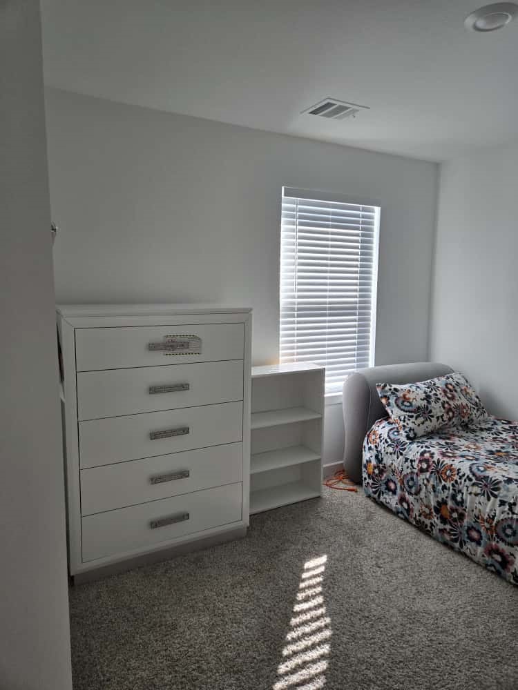 7122 Clearwater Cv Drive Cypress, TX 77433 - Photo 8 of 10 a bedroom with a bed and a window