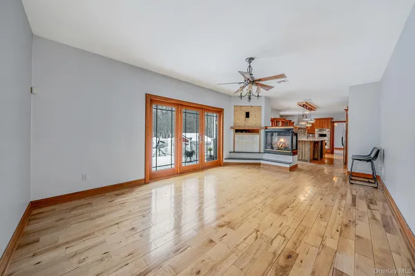 a view of an empty room with a fireplace