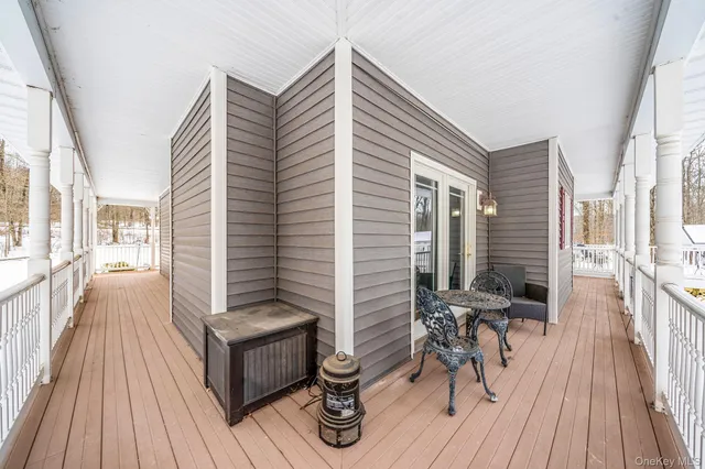 a view of a patio with a table and chairs