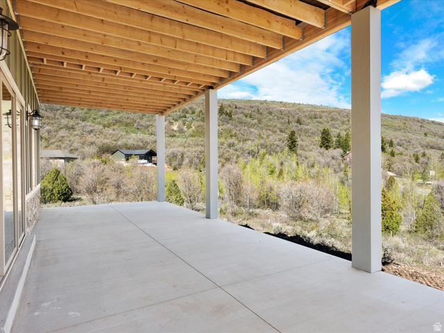 1159 North Broad Hollow Road Garden City, UT 84028 - Photo 49 of 55 Expansive concrete patio offering an outdoor living area