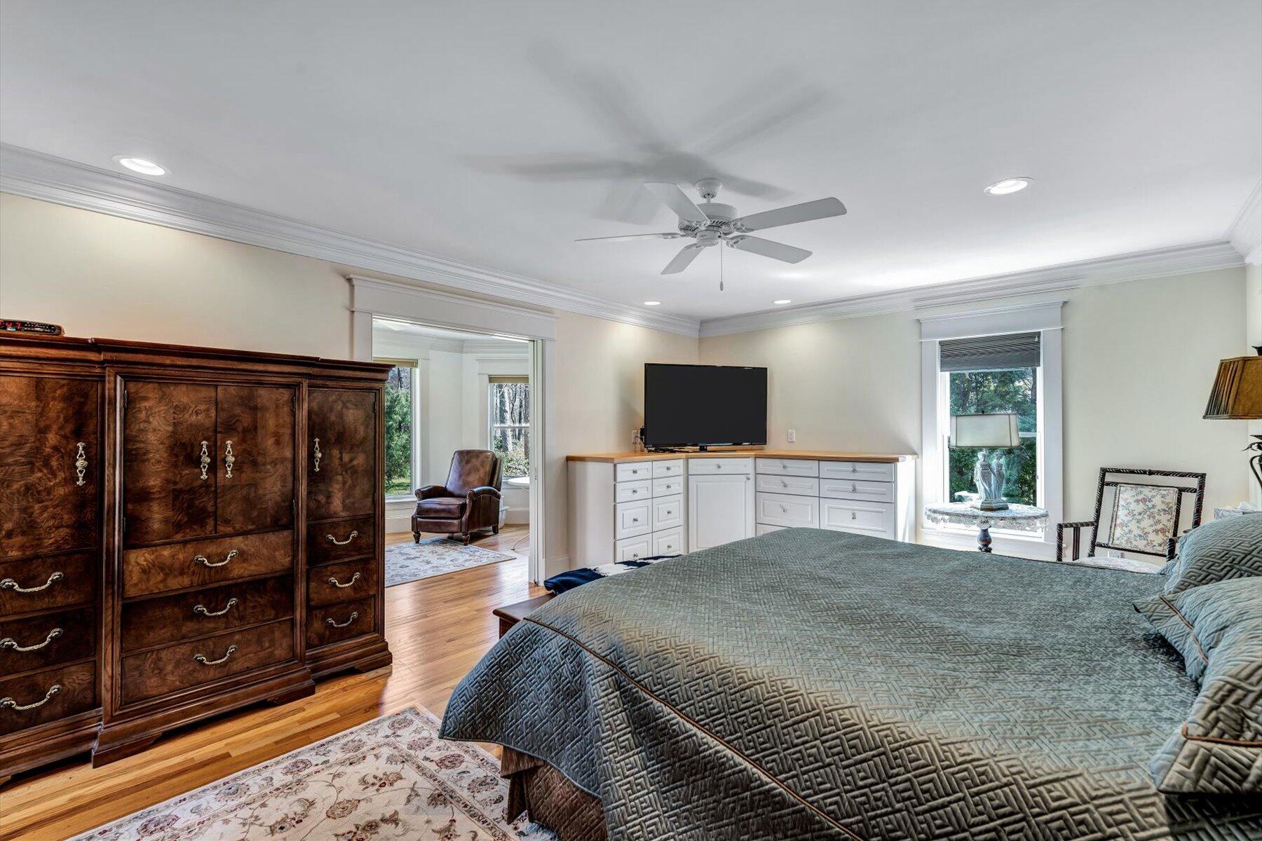 11 Reflection Drive Sandwich, MA 02563 - Photo 12 of 44 a bedroom with a bed and a flat screen tv
