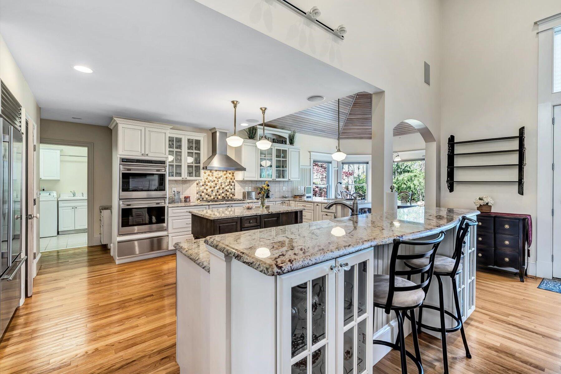 11 Reflection Drive Sandwich, MA 02563 - Photo 23 of 44 a kitchen with stainless steel appliances granite countertop a kitchen island a stove and a wooden floors