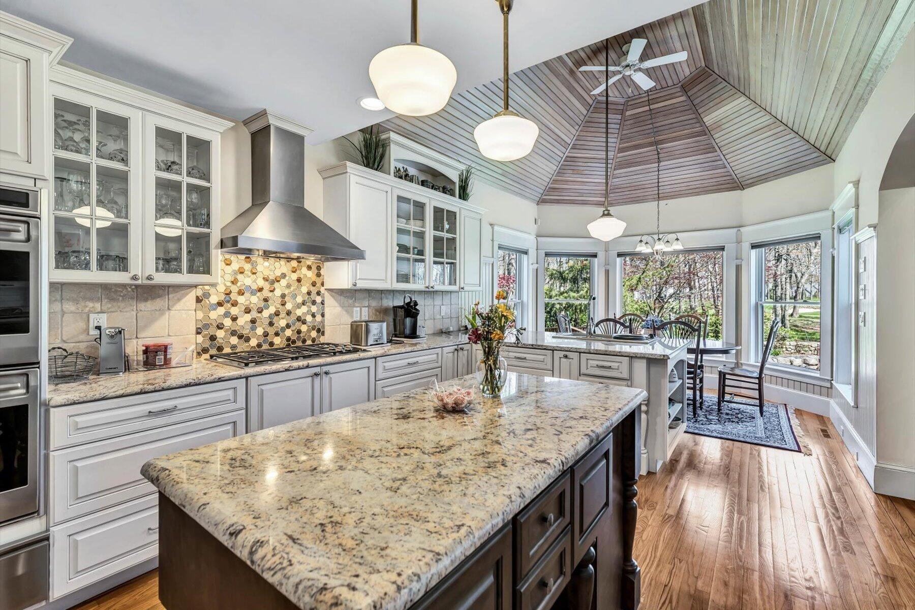 11 Reflection Drive Sandwich, MA 02563 - Photo 25 of 44 a kitchen with stainless steel appliances granite countertop counter space and wooden floors