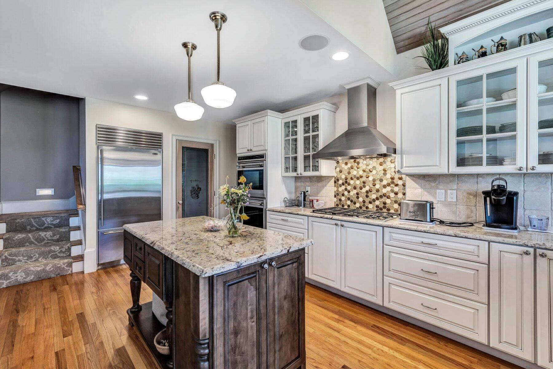 11 Reflection Drive Sandwich, MA 02563 - Photo 26 of 44 a kitchen with stainless steel appliances granite countertop a stove and cabinets