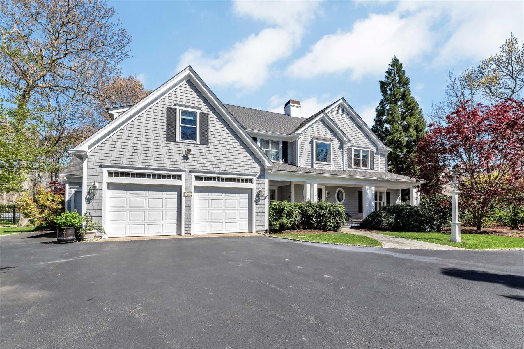 11 Reflection Drive Sandwich, MA 02563 - Photo 3 of 44 a front view of a house with a garden and trees