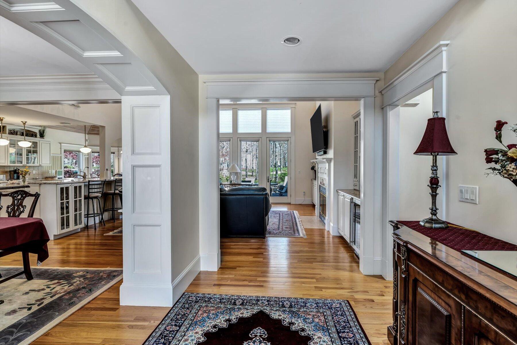 11 Reflection Drive Sandwich, MA 02563 - Photo 31 of 44 a hallway view with wooden floor and a rug