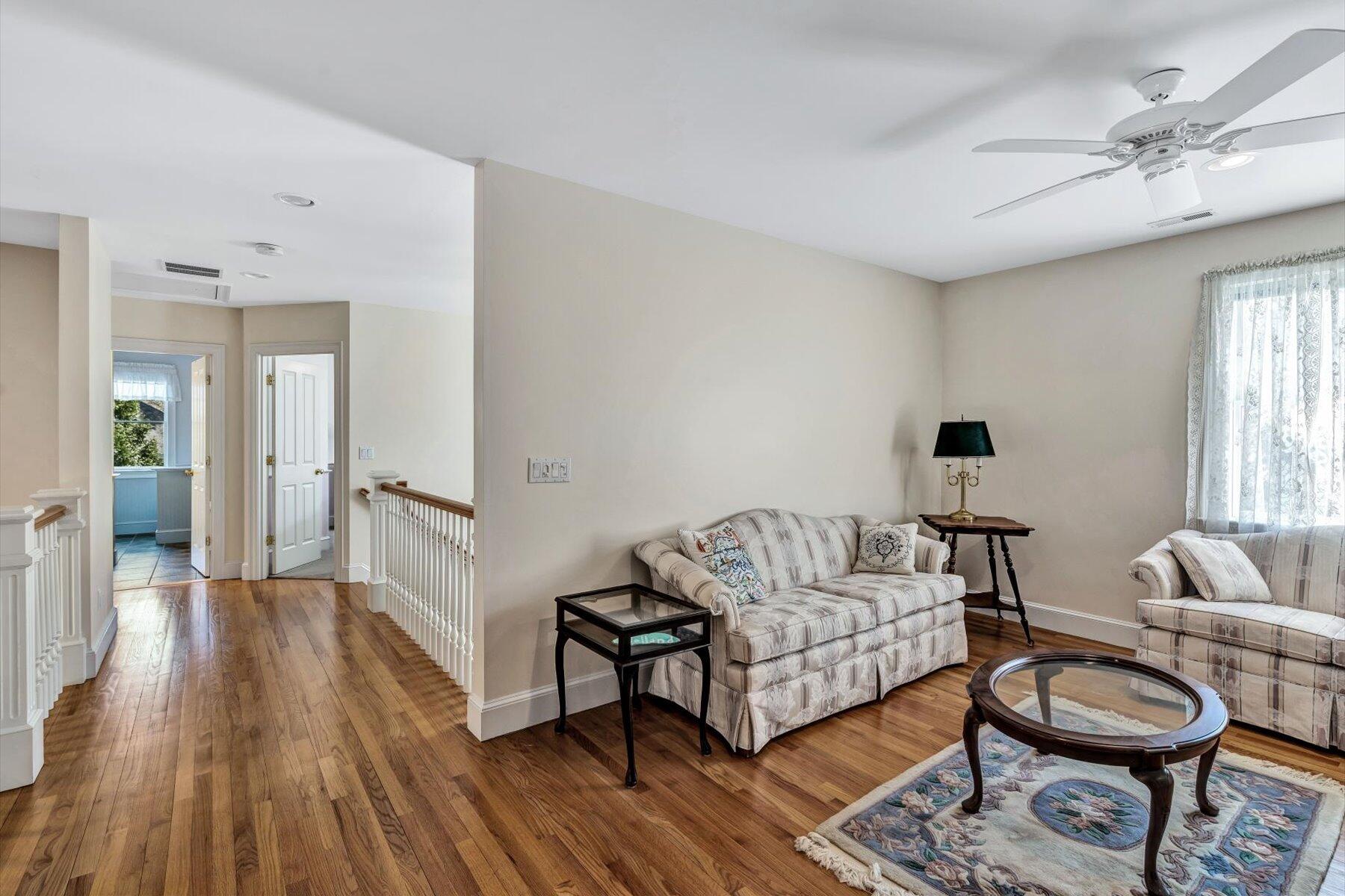 11 Reflection Drive Sandwich, MA 02563 - Photo 35 of 44 a living room with furniture and a wooden floor