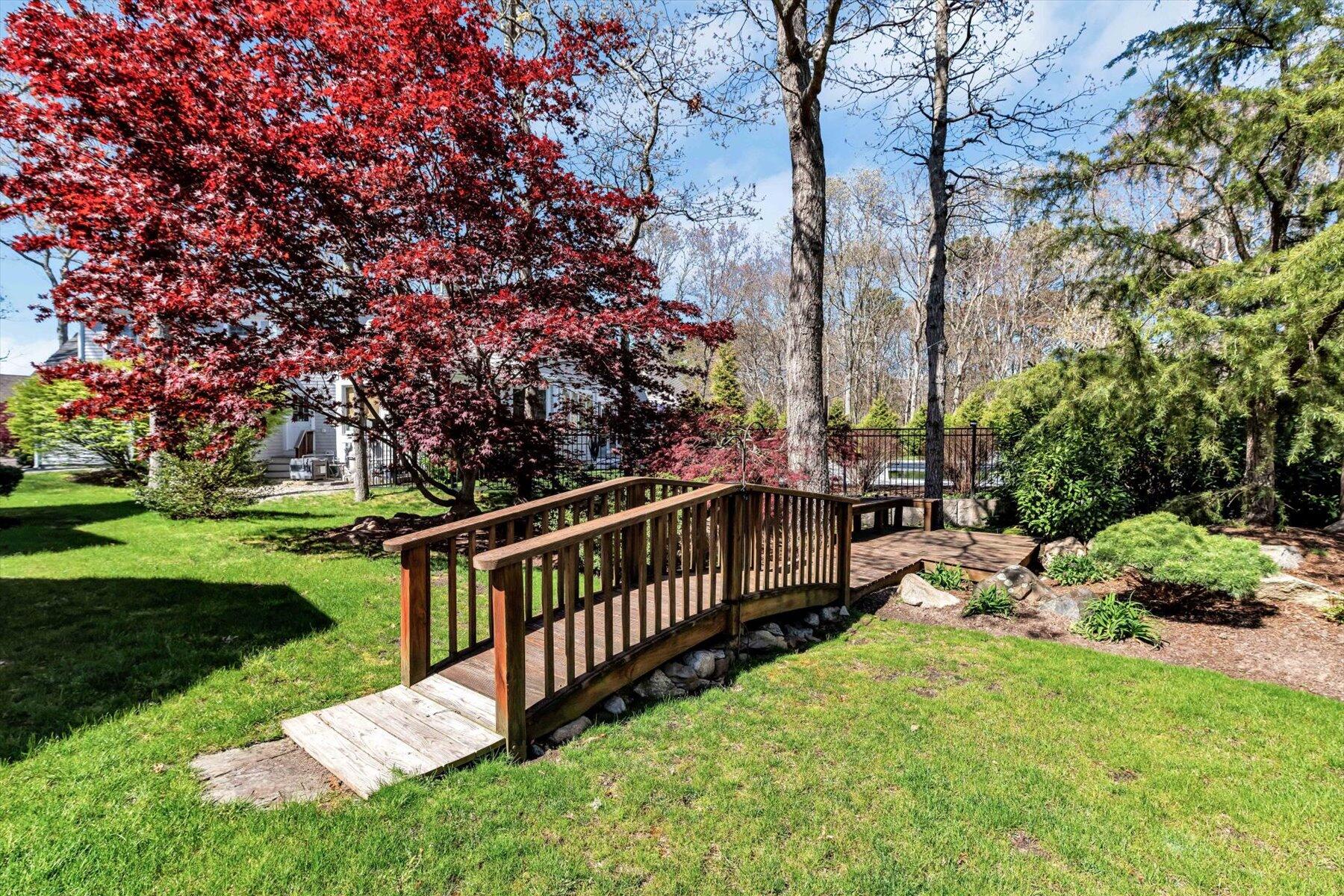 11 Reflection Drive Sandwich, MA 02563 - Photo 5 of 44 a view of a deck with a yard