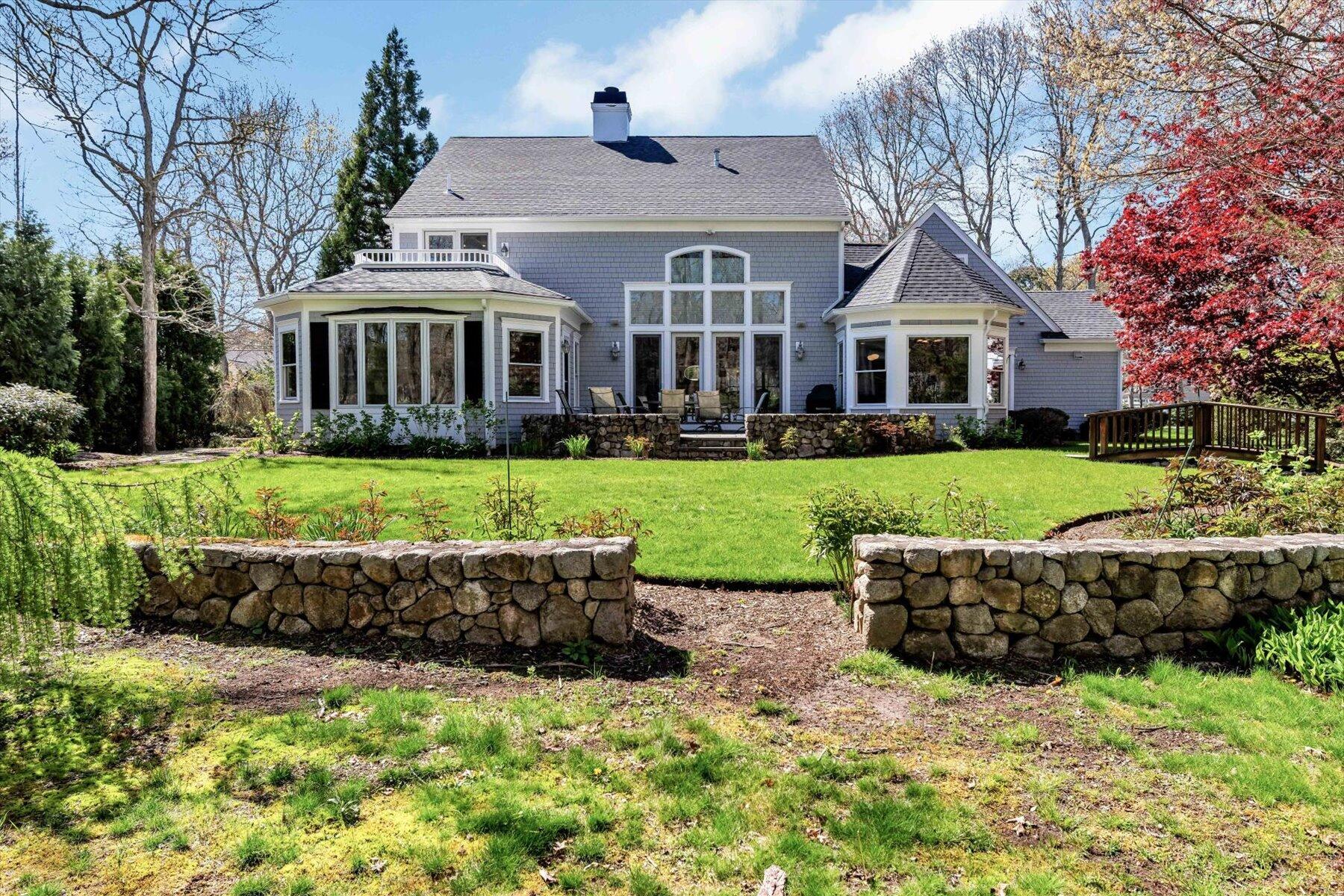 11 Reflection Drive Sandwich, MA 02563 - Photo 8 of 44 a front view of a house with a garden