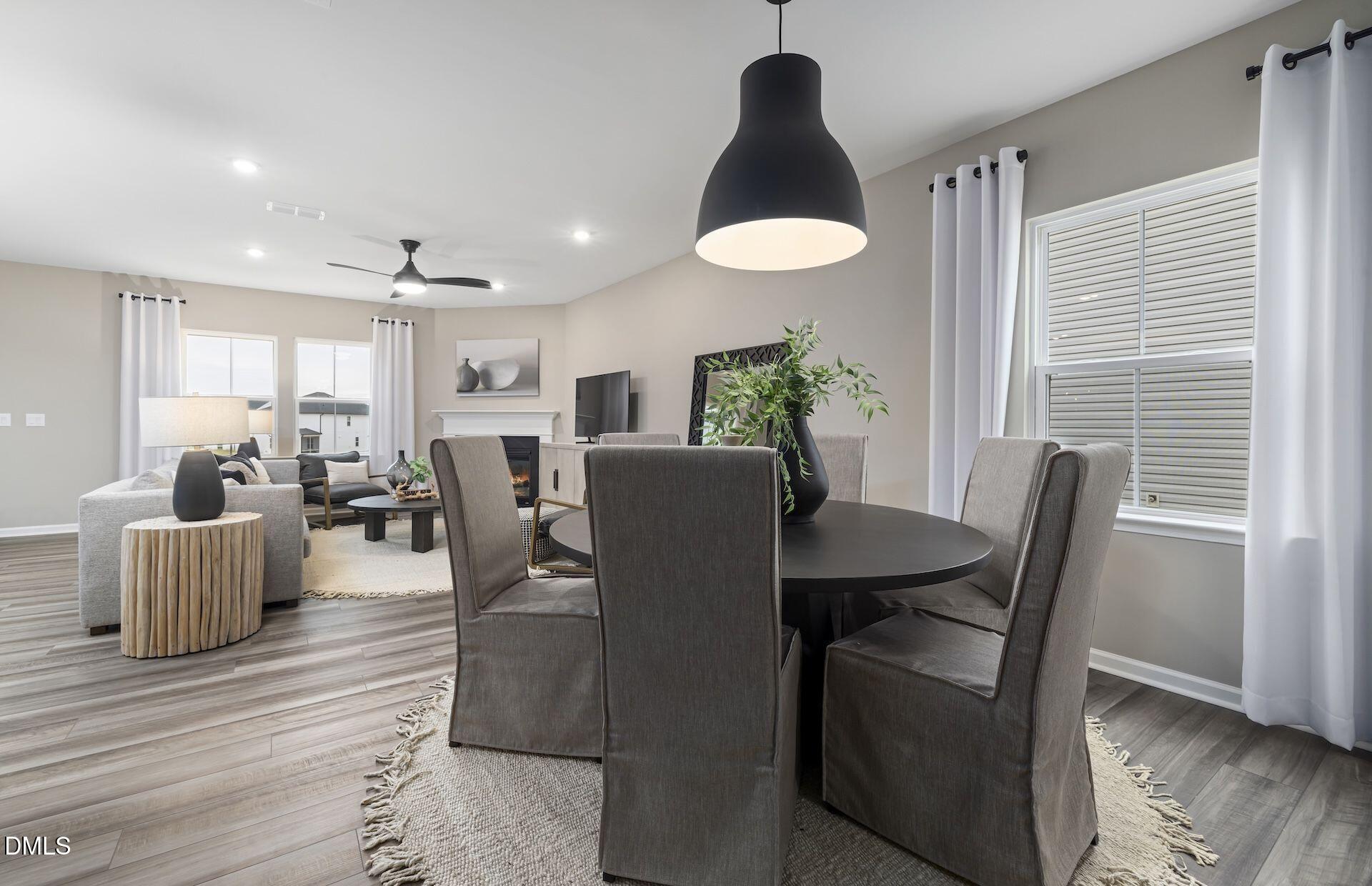 613 Ben Ledi Court Raleigh, NC 27603 - Photo 5 of 32 a view of a dining room with furniture and wooden floor