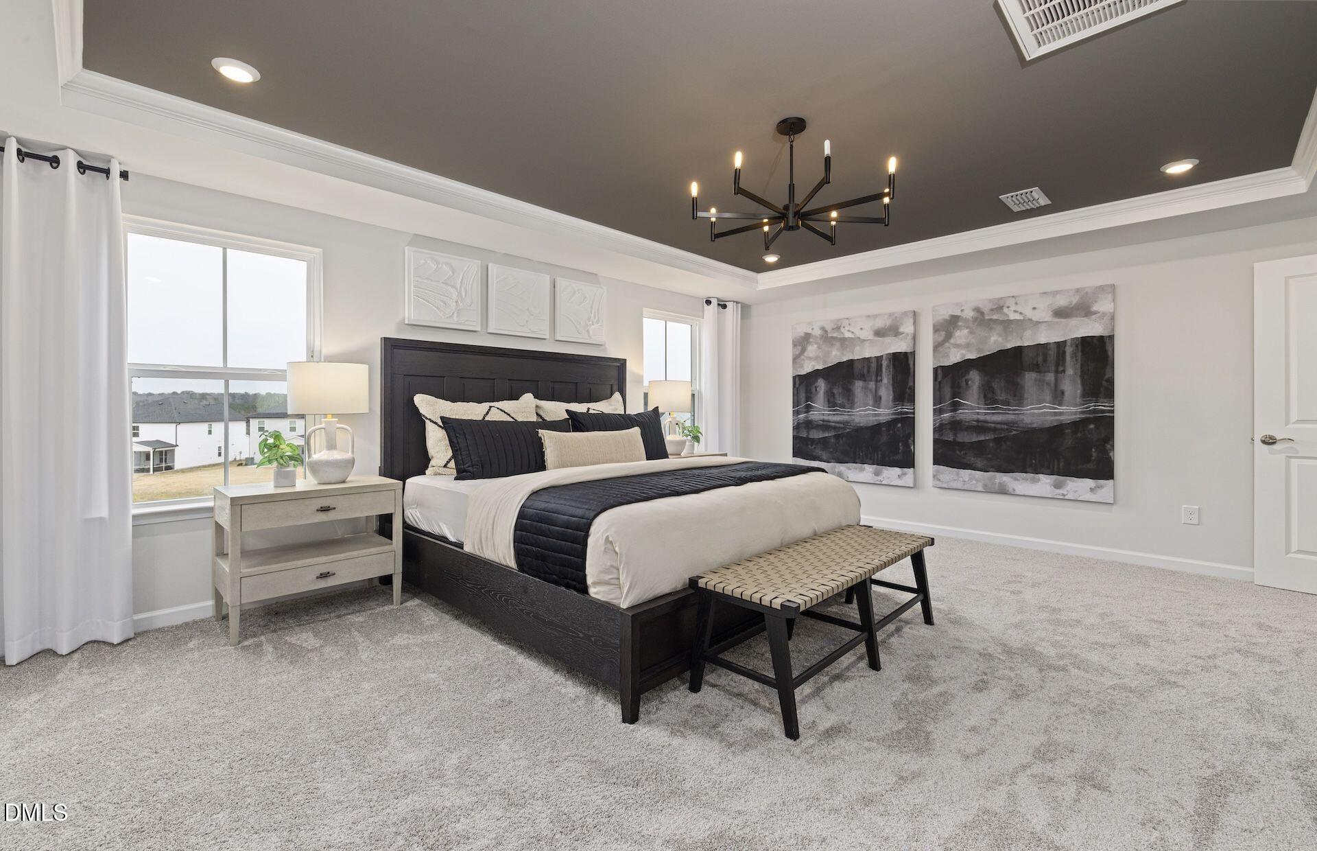 613 Ben Ledi Court Raleigh, NC 27603 - Photo 9 of 32 a bedroom with a large bed and a window