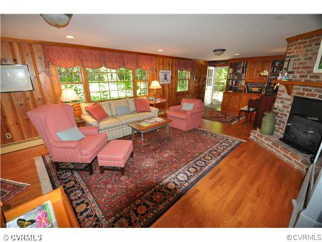 4324 Croatan Road Richmond, VA 23235 - Photo 11 of 22 a living room with furniture a rug and a floor to ceiling window