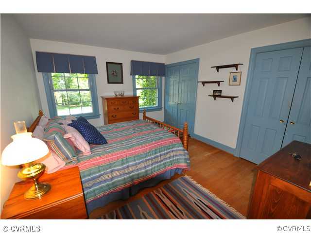 4324 Croatan Road Richmond, VA 23235 - Photo 15 of 22 a bedroom with a bed and a large window