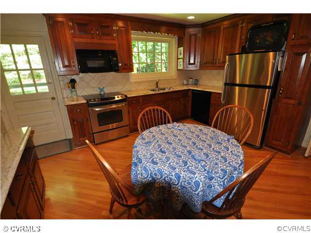 4324 Croatan Road Richmond, VA 23235 - Photo 8 of 22 a kitchen that has a sink and a microwave