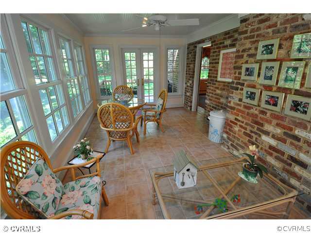 4324 Croatan Road Richmond, VA 23235 - Photo 9 of 22 a living room with furniture and a floor to ceiling window