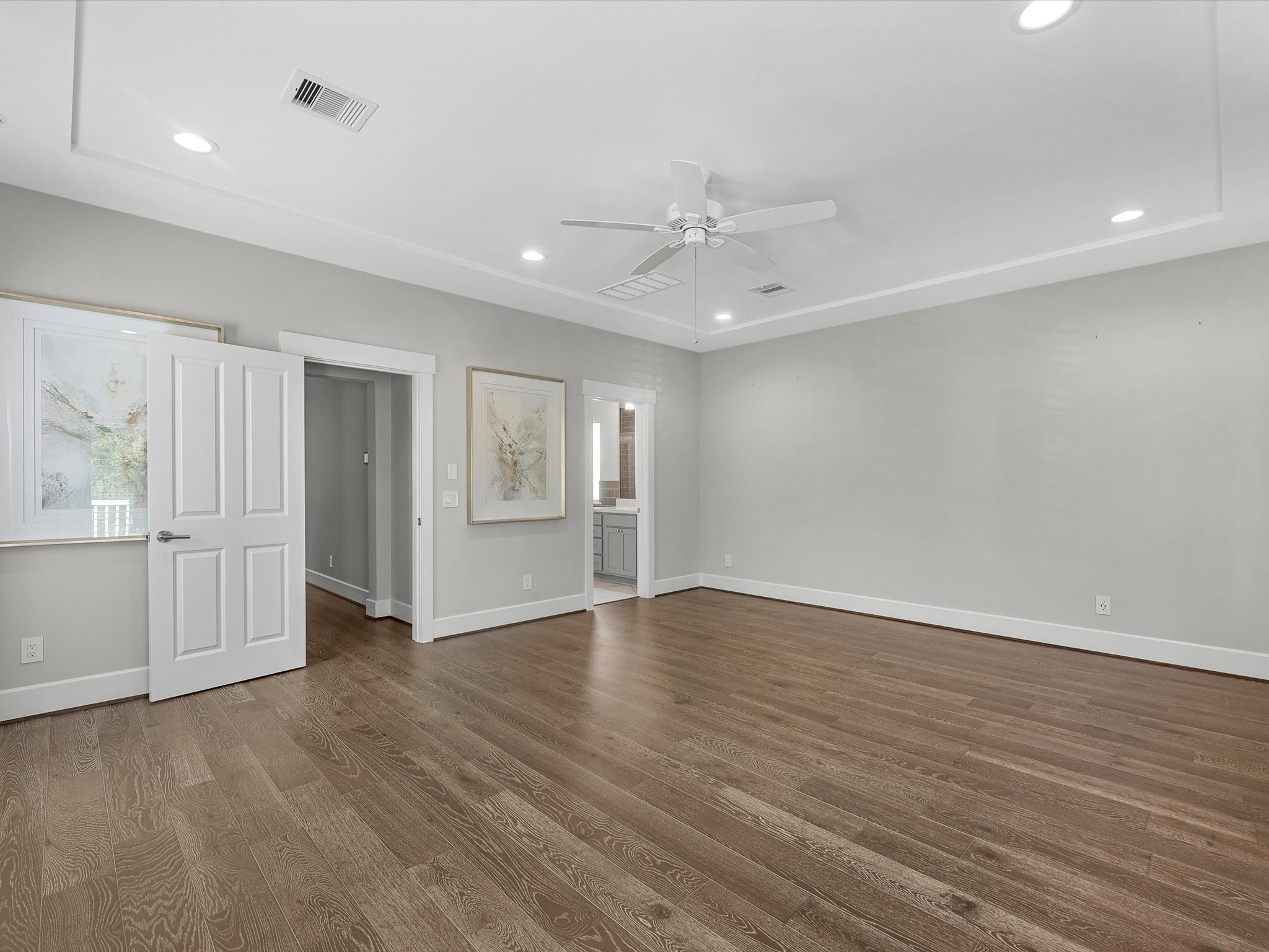 15 Black Dog Lane Spring, TX 77389 - Photo 15 of 32 a view of an empty room with window and wooden floor