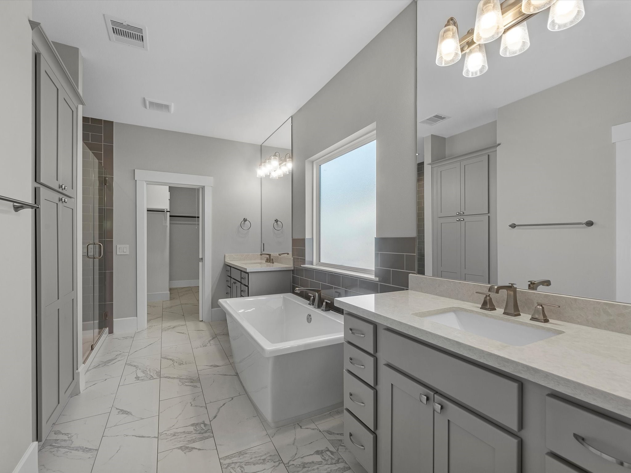 15 Black Dog Lane Spring, TX 77389 - Photo 16 of 32 a spacious bathroom with a sink a mirror and a bathtub