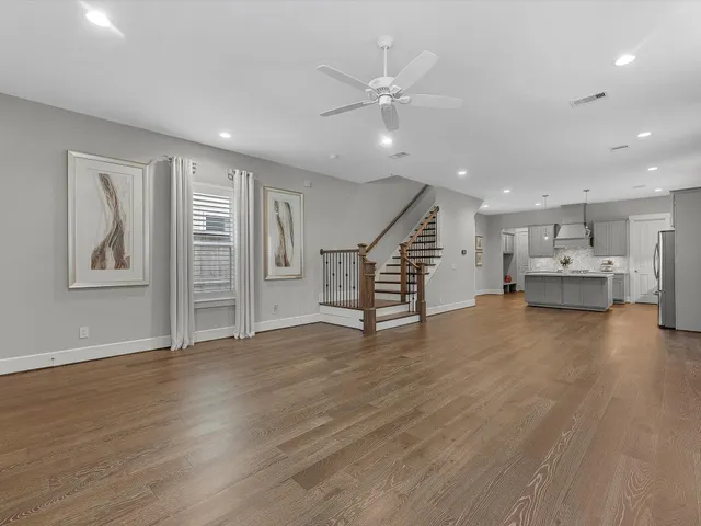 a view of kitchen with furniture and wooden floor