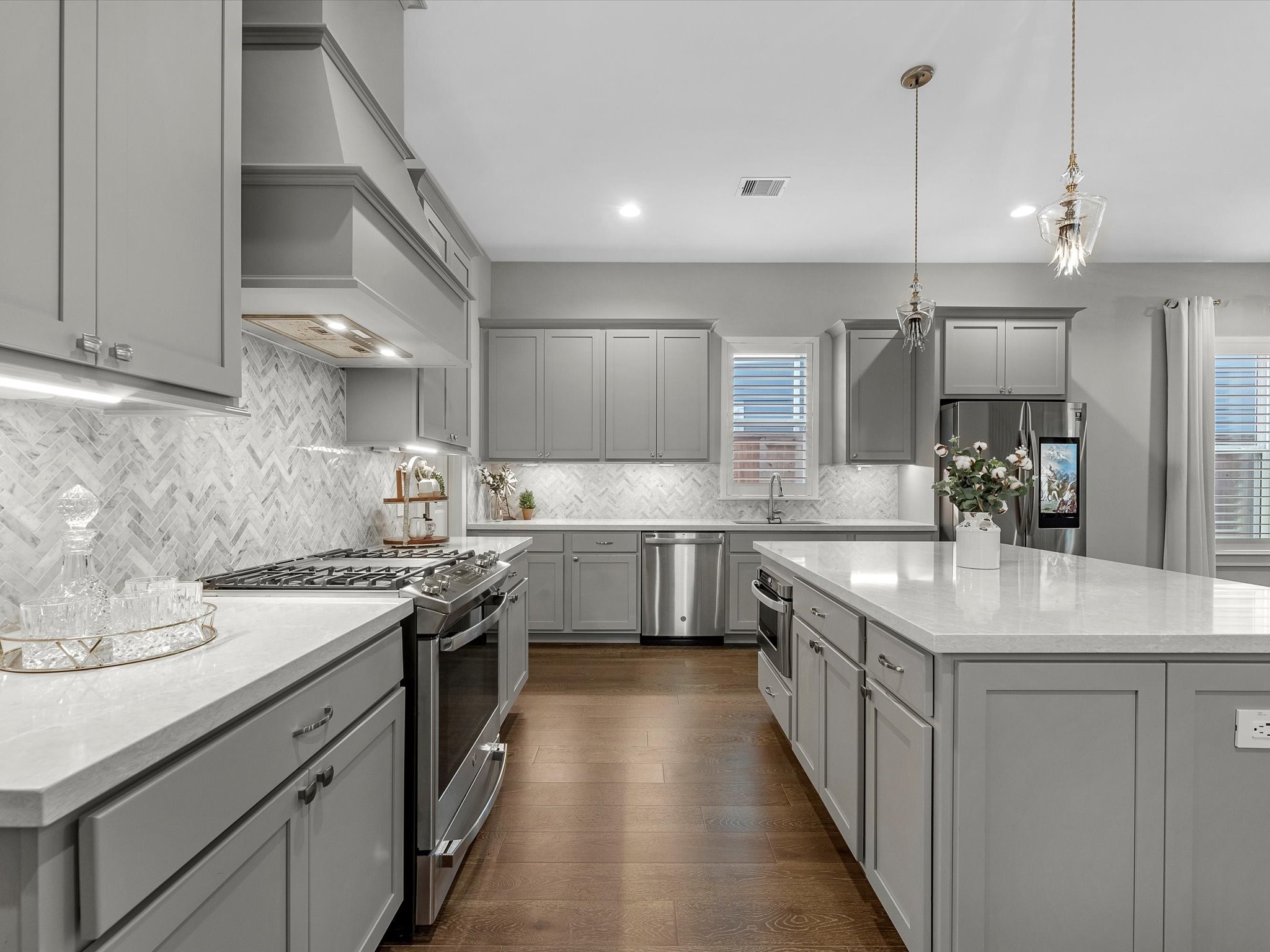 15 Black Dog Lane Spring, TX 77389 - Photo 7 of 32 a kitchen with stainless steel appliances a sink stove and cabinets