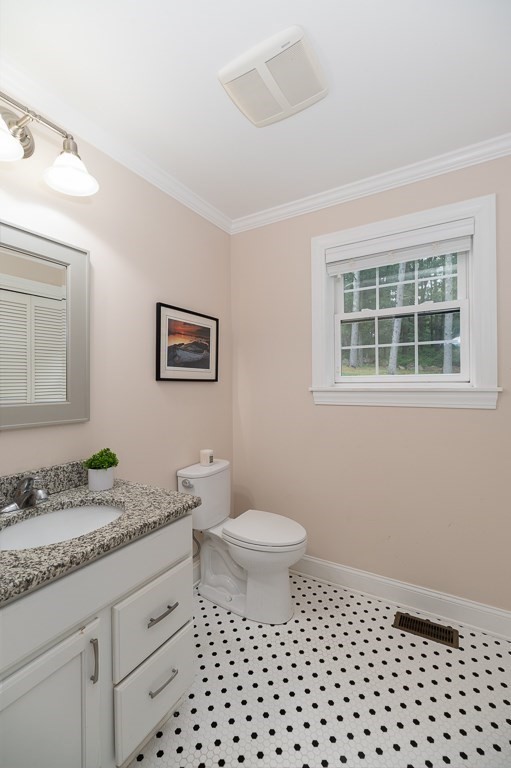 14 Overledge Road Manchester, MA 01944 - Photo 19 of 36 a bathroom with a granite countertop sink toilet a mirror and a shower