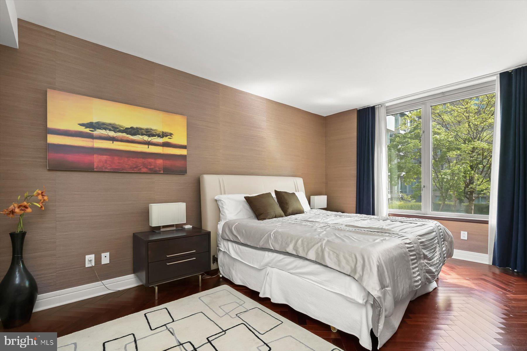 1155 23rd Street Northwest, Unit 6G Washington, DC 20037 - Photo 12 of 15 a bedroom with a bed and a window