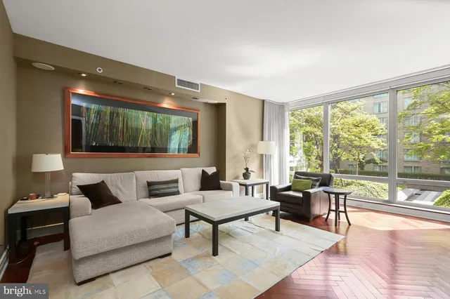 a living room with furniture and a large window