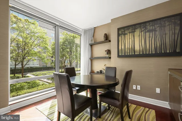 a view of a dining room with furniture window and outside view