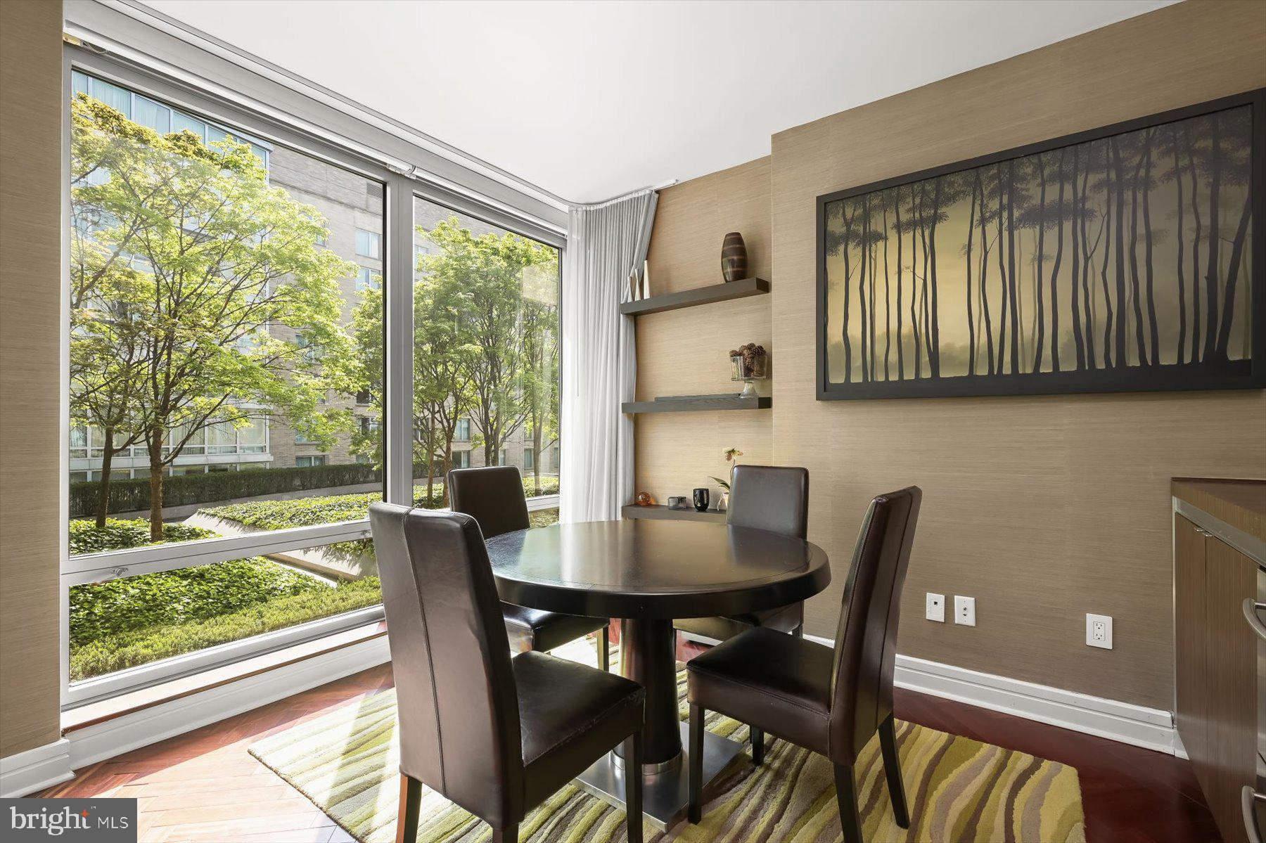 1155 23rd Street Northwest, Unit 6G Washington, DC 20037 - Photo 6 of 15 a view of a dining room with furniture window and outside view