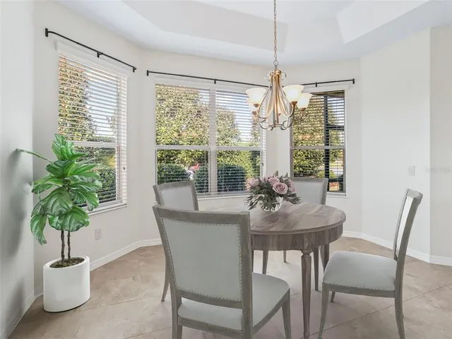 an empty room with windows and outdoor view