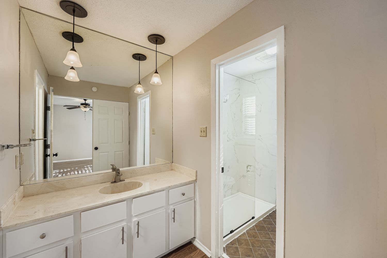 1415 Lance Way Austin, TX 78758 - Photo 19 of 29 a bathroom with a tub sink and mirror