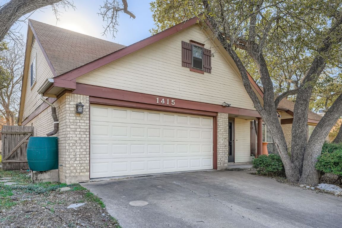 1415 Lance Way Austin, TX 78758 - Photo 2 of 29 a small white building with a outdoor space