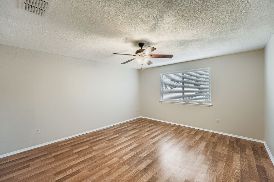 1415 Lance Way Austin, TX 78758 - Photo 21 of 29 a view of a room with a fan