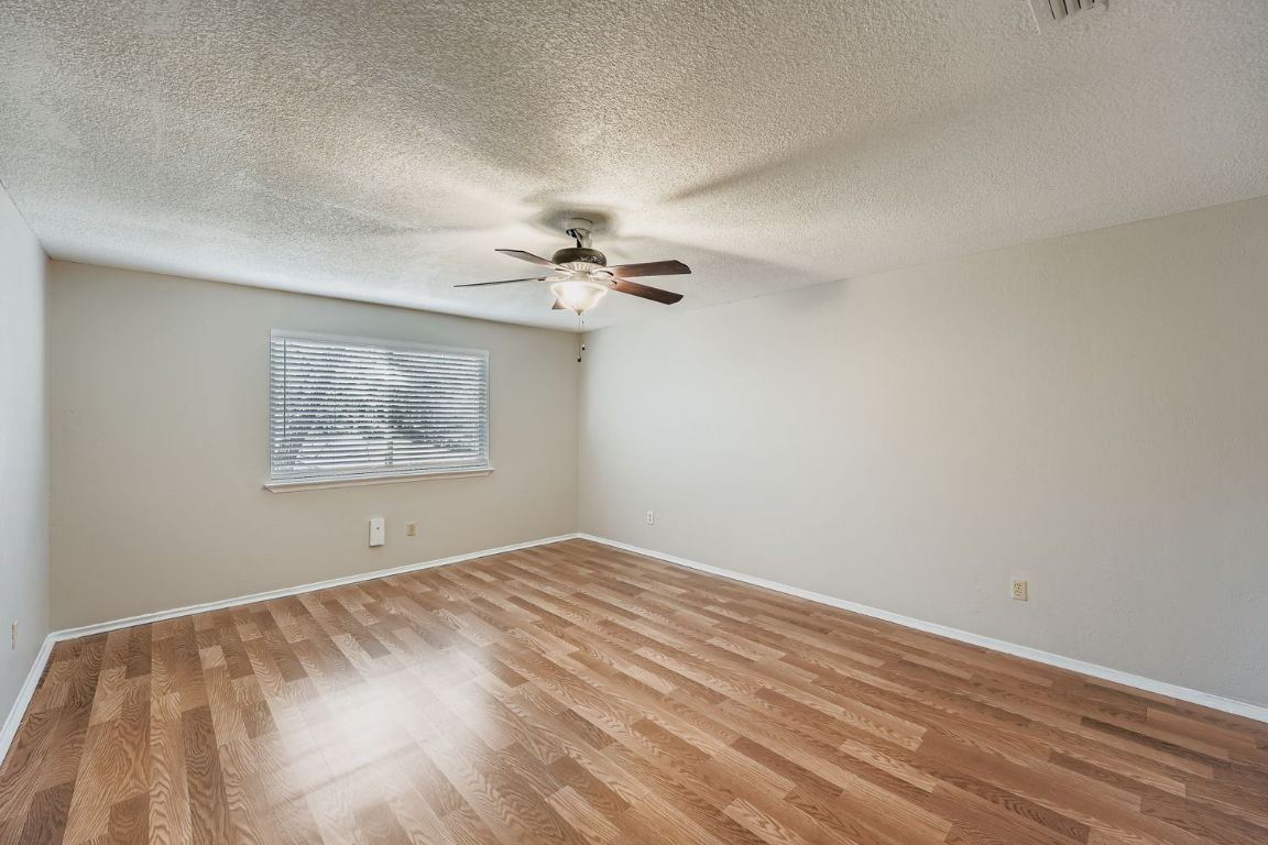 1415 Lance Way Austin, TX 78758 - Photo 22 of 29 a view of an empty room with a window