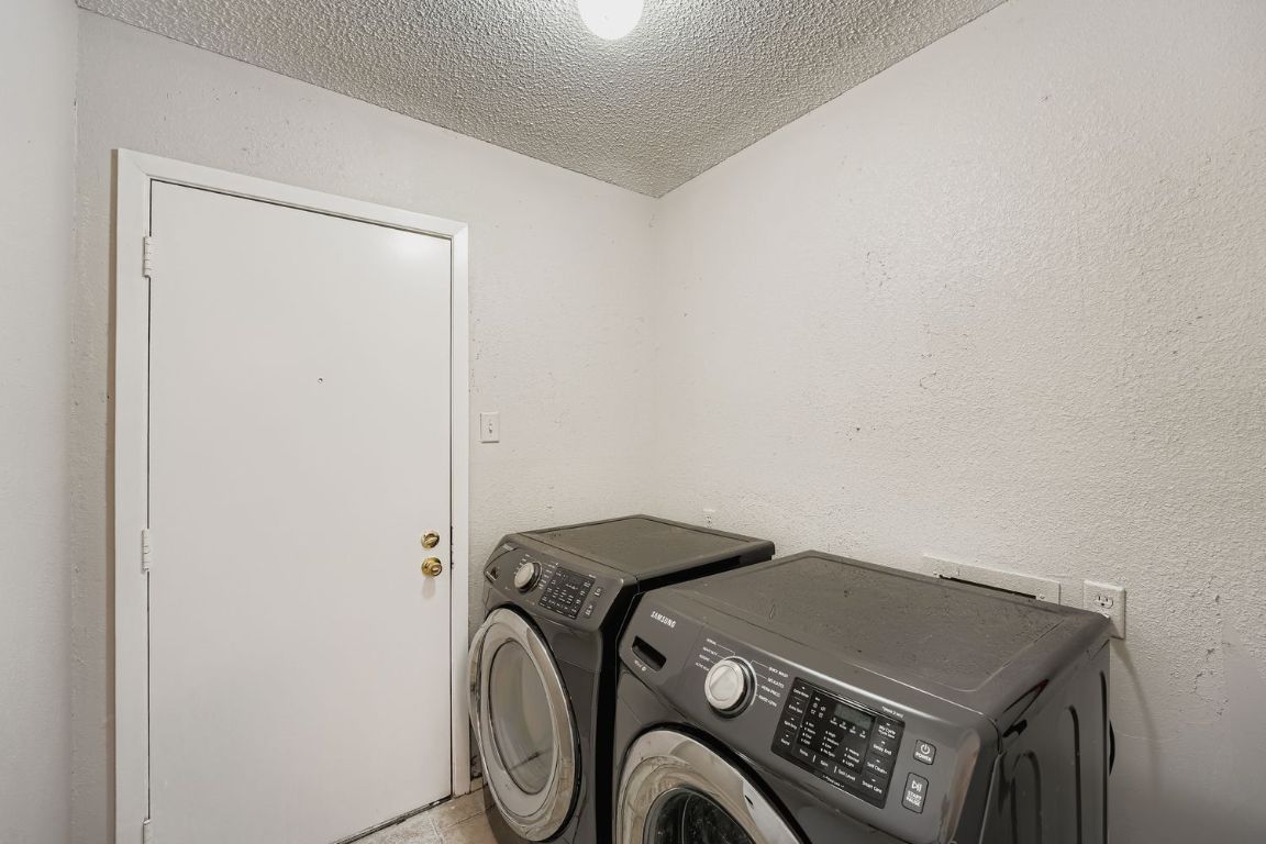 1415 Lance Way Austin, TX 78758 - Photo 24 of 29 a utility room with dryer and washer