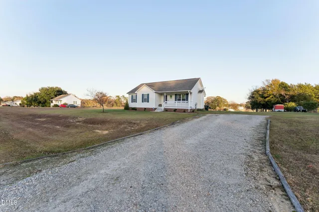 a view of an house with outdoor space and sitting area
