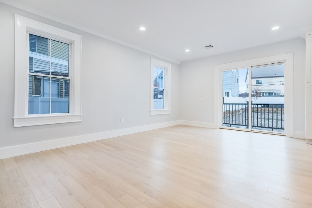 13 McKone Street, Unit 1 Boston, MA 02122 - Photo 11 of 36 a view of an empty room with a window