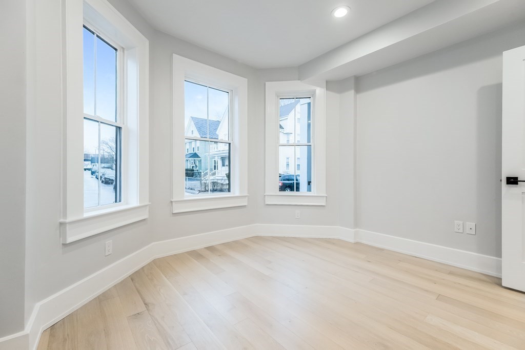 13 McKone Street, Unit 1 Boston, MA 02122 - Photo 16 of 36 an empty room with windows