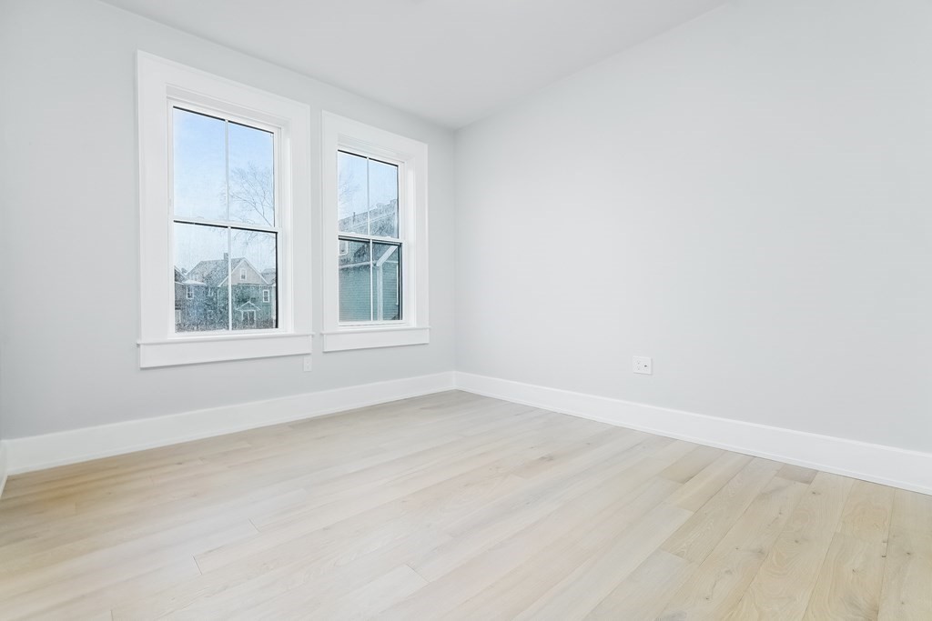 13 McKone Street, Unit 1 Boston, MA 02122 - Photo 25 of 36 an empty room with a window
