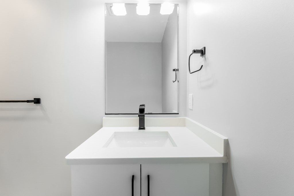 13 McKone Street, Unit 1 Boston, MA 02122 - Photo 27 of 36 a bathroom with a sink and mirror