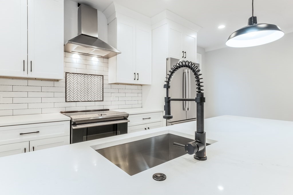 13 McKone Street, Unit 1 Boston, MA 02122 - Photo 8 of 36 a kitchen with a sink appliances and cabinets