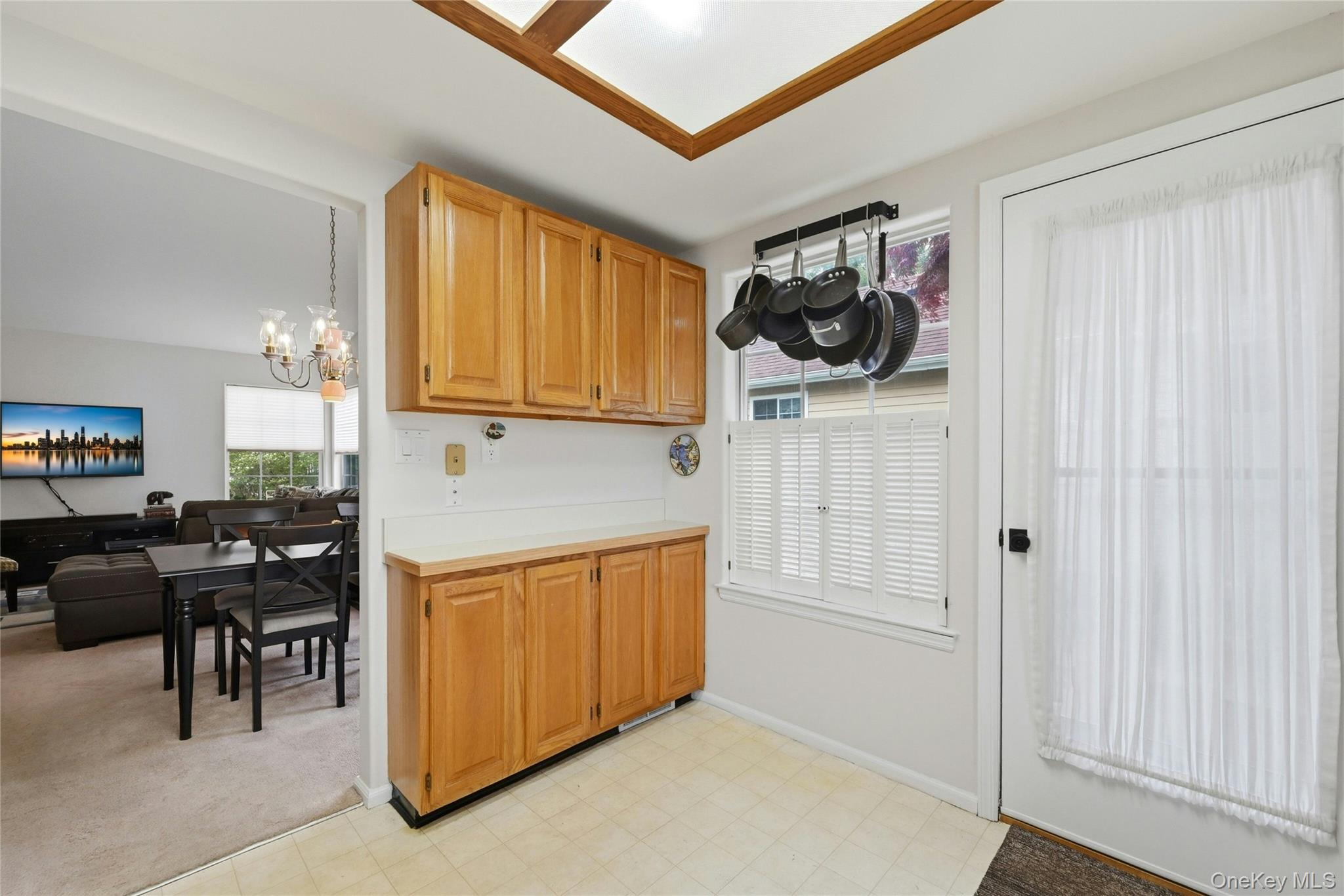 9 Baldwin Court, Unit 9 Ridge, NY 11961 - Photo 11 of 27 a view of a livingroom with furniture and workspace