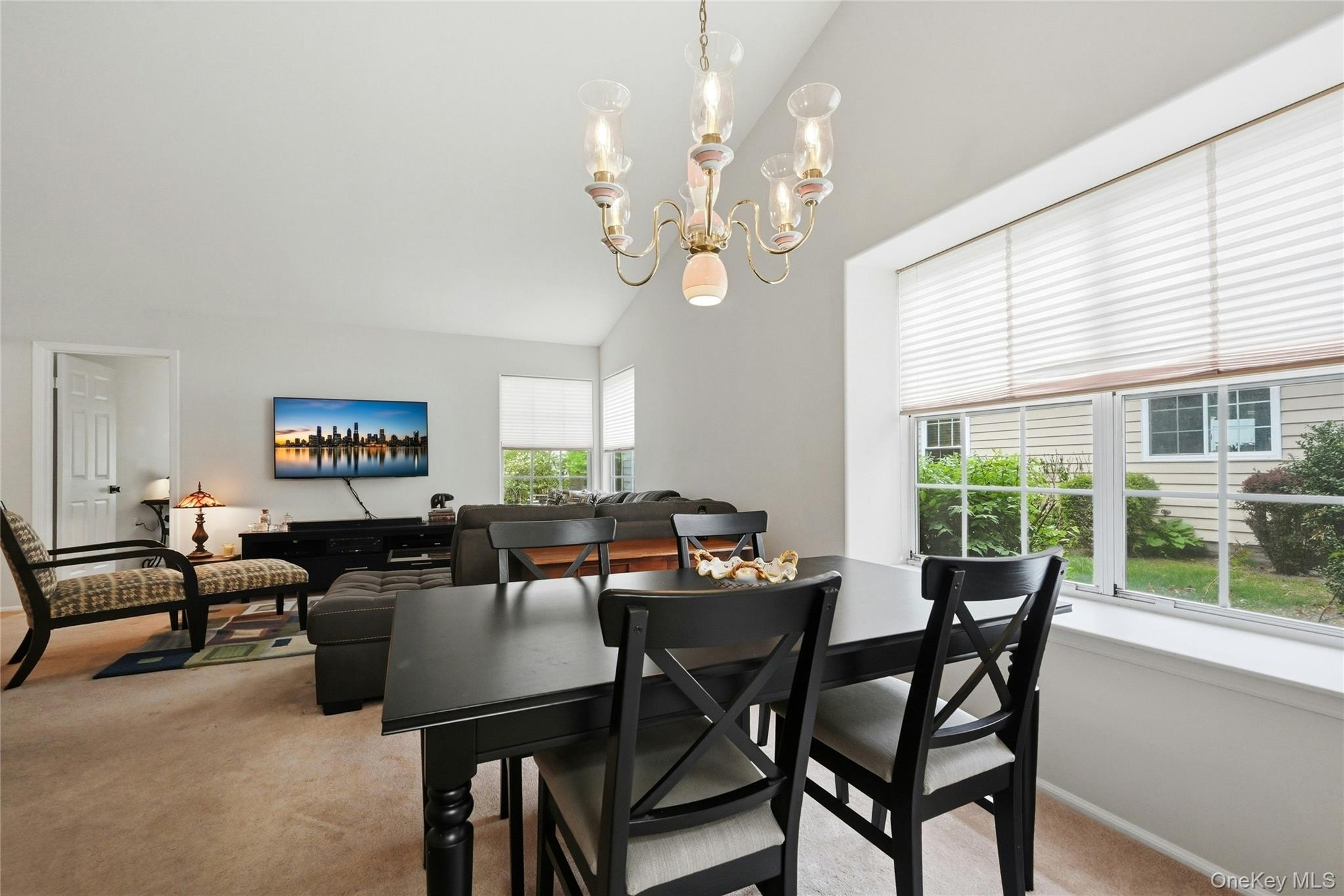 9 Baldwin Court, Unit 9 Ridge, NY 11961 - Photo 13 of 27 a view of a dining room with furniture window and outside view